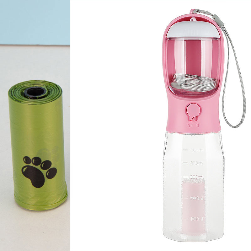 Pink pet water bottle with clear container and green pet waste bag dispenser on a white background